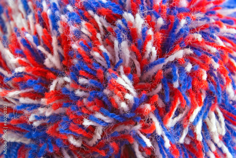 Wool yarn ends from bobble hat, closeup