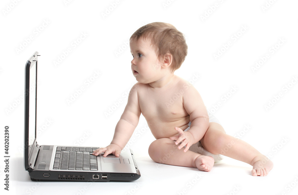 Cute baby girl and laptop isolated on white Cute baby girl and laptop isolated on white