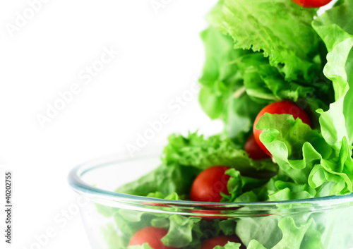 Light lettuce and tomatoes flying salad concept