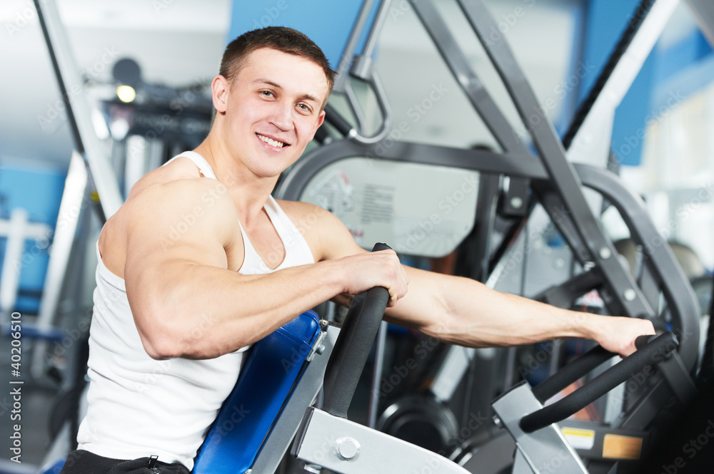 bodybuilder man doing biceps muscle exercises bodybuilder man doing biceps muscle exercises