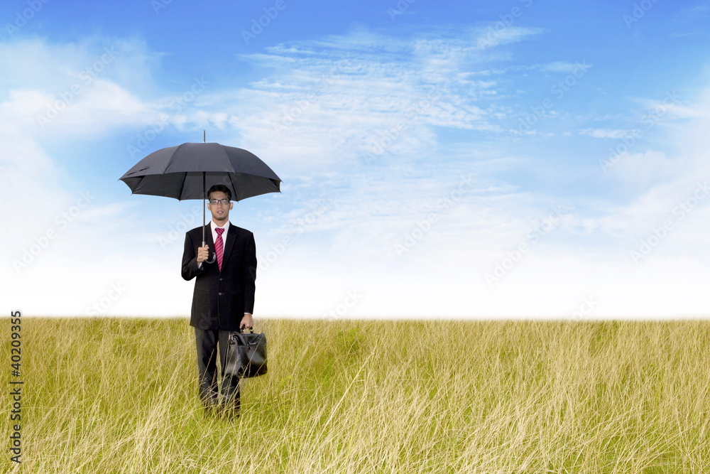 Businessman with umbrella shot outdoor Businessman with umbrella shot outdoor
