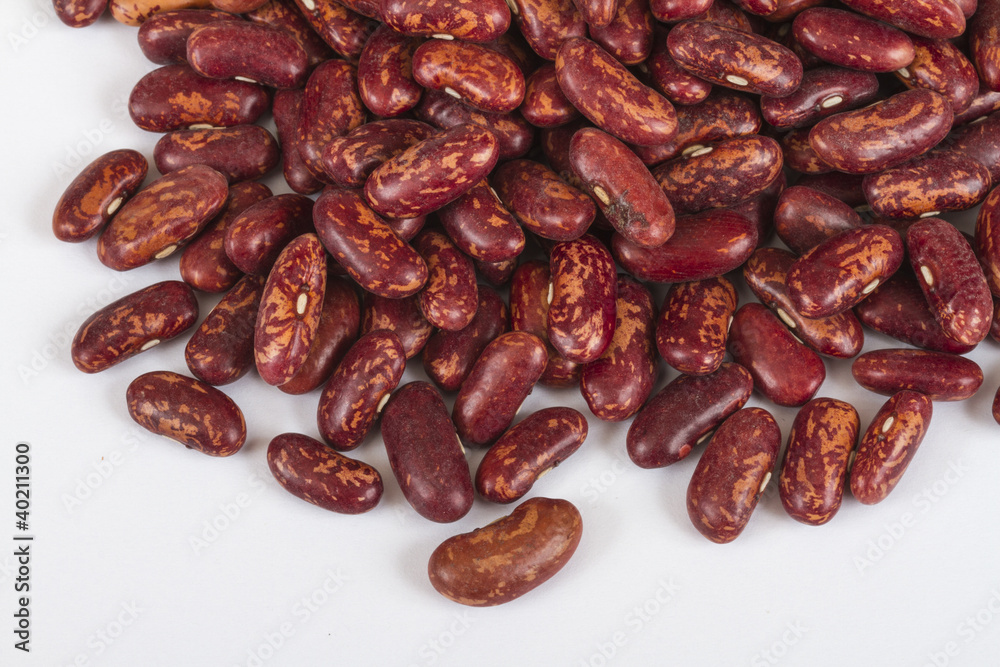 A handful of red beans. View from above. Isolated on white backg A handful of red beans. View from above. Isolated on white backg