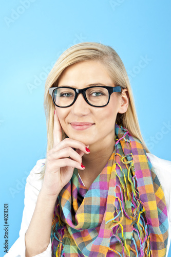 Young woman against the blue background