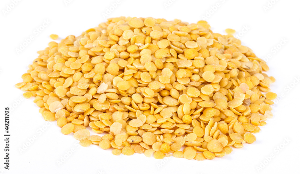 Yellow lentils isolated on white background.Macro shot