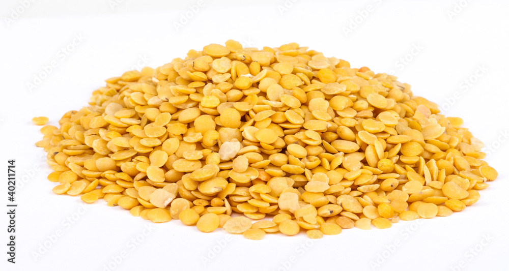 Yellow lentils isolated on white background.Macro shot Yellow lentils isolated on white background.Macro shot