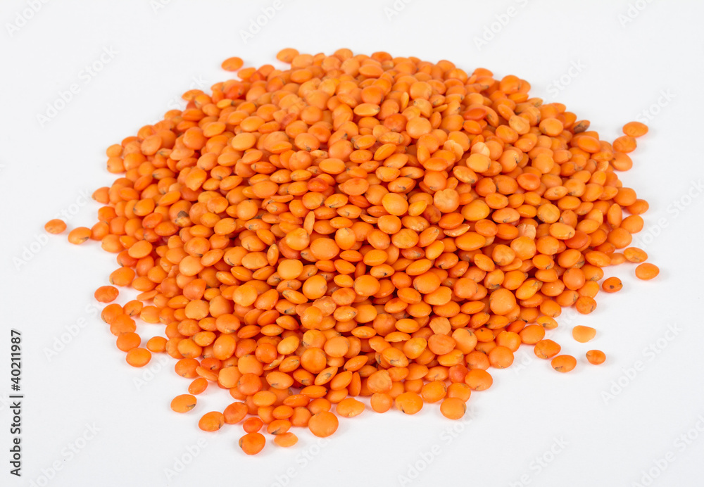 Heap of raw red lentils isolated on white background Heap of raw red lentils isolated on white background