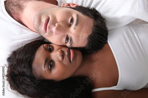 Young couple in bed photo