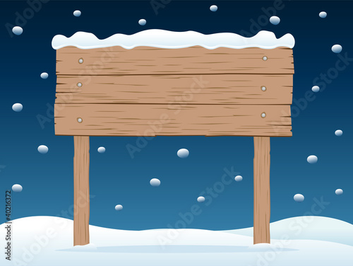 wooden signboard in snowy night