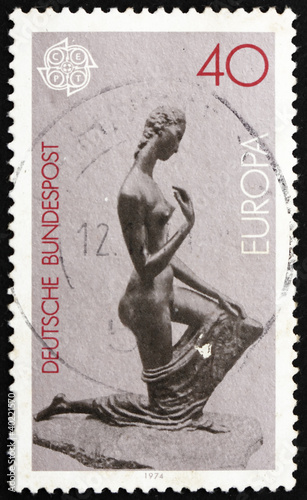 Postage stamp Germany 1974 Kneeling Woman, Sculpture by Lehmbruc photo