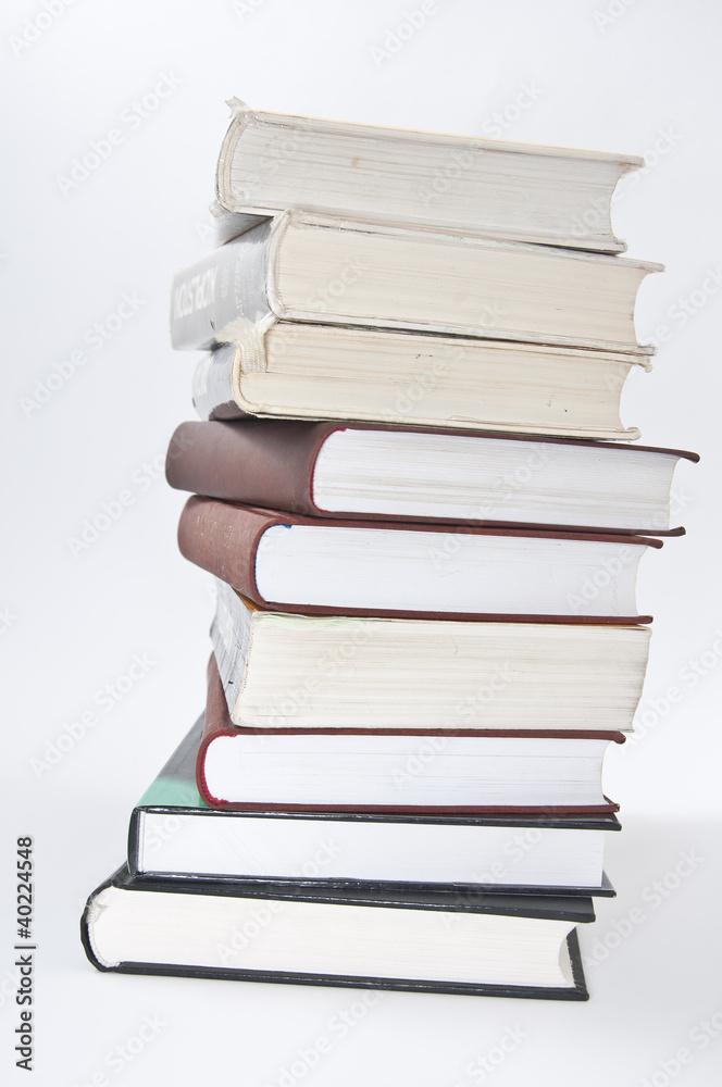 Stack of books with opened notebook and glasses Stack of books with opened notebook and glasses