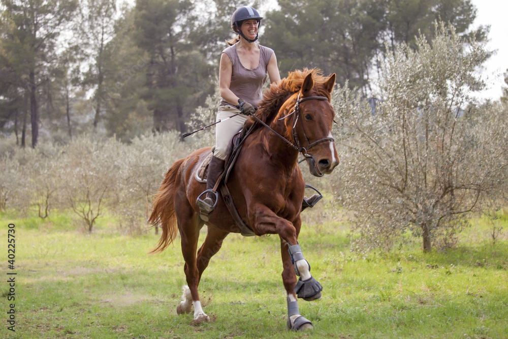 Young woman riding a horse Young woman riding a horse