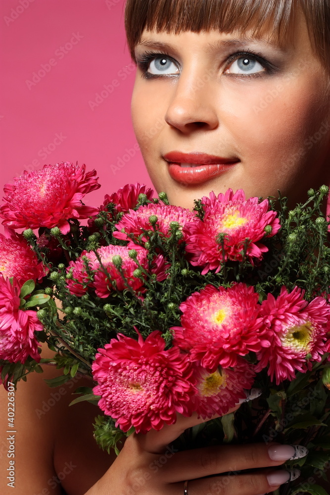 Portrait of a young woman with pink flowers Portrait of a young woman with pink flowers