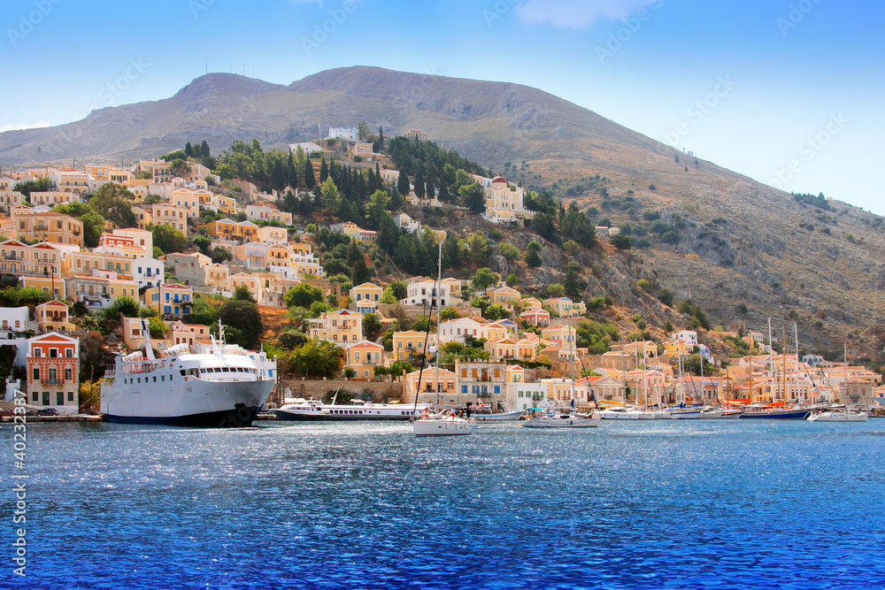 boats and houses on symi island, Greece..