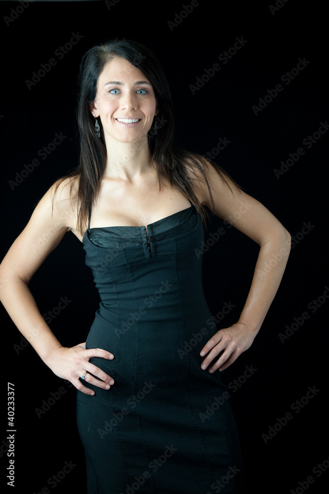 pretty woman smiling and looking at camera hand on hips pretty woman smiling and looking at camera hand on hips
