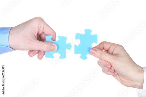Hands with puzzle isolated on white