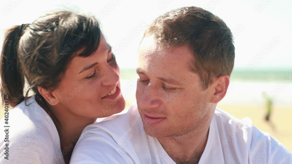 Portrait of young happy couple on the beach Portrait of young happy couple on the beach