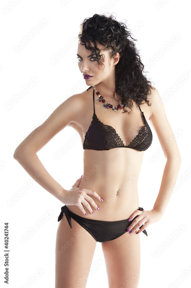 sensual and cute girl in swimsuit with both hands on the hips sensual and cute girl in swimsuit with both hands on the hips