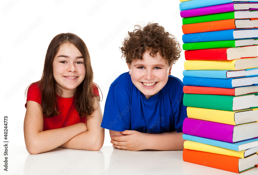 Kids behind pile of books isolated on white background