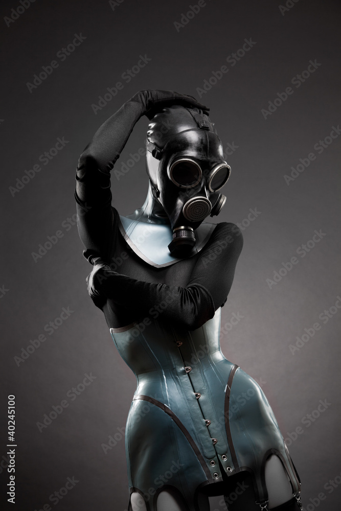 Woman in latex corset and gas mask Stock Photo | Adobe Stock