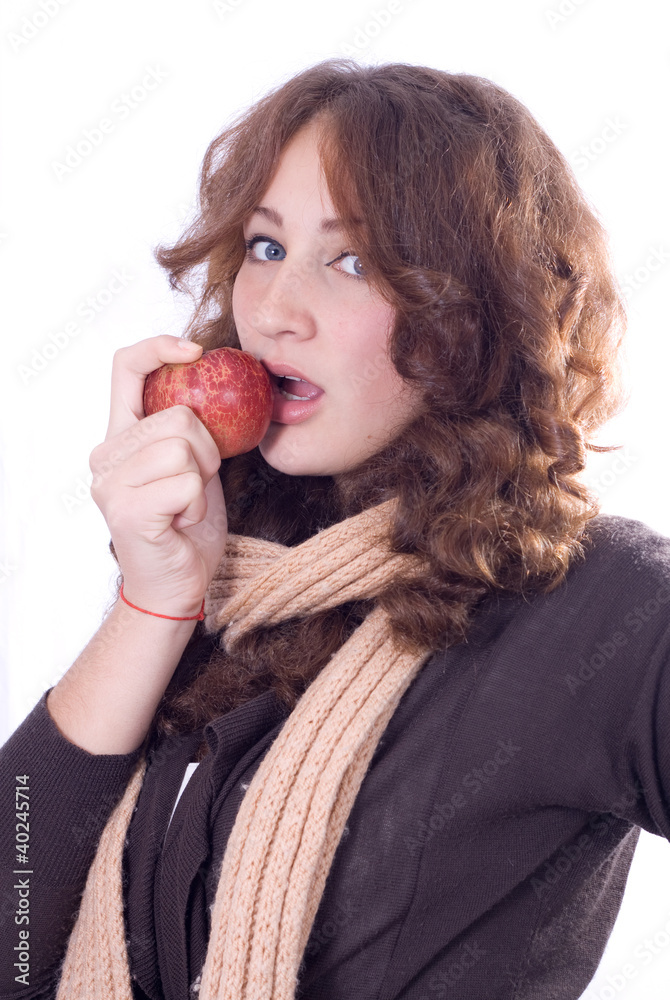 Young beautiful girl bites an apple. Young beautiful girl bites an apple.