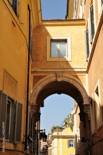 Arc bridge between houses over lane in Rome Quarter