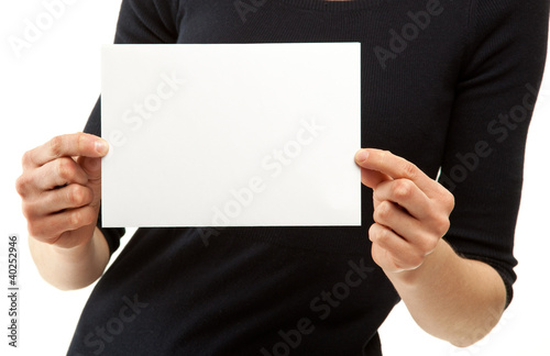 Woman's hands holding blank sheet of paper