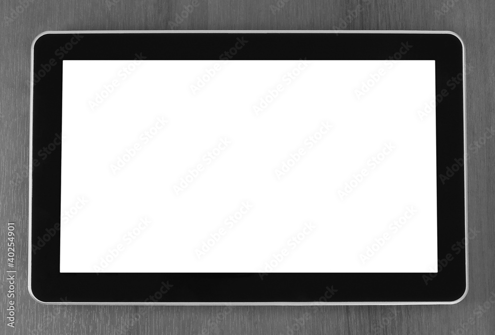 Touch screen device on wooden background Touch screen device on wooden background