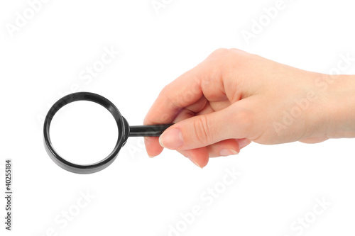 Woman hand holds magnifier on white background