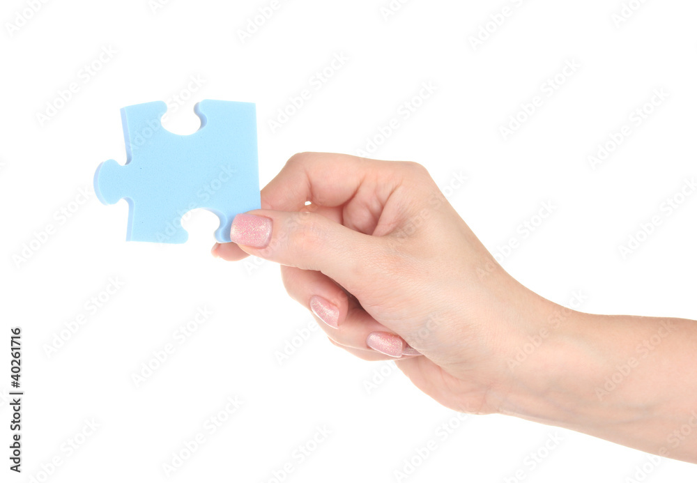 Blue puzzle with a hand isolated on white Blue puzzle with a hand isolated on white