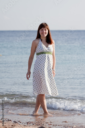 woman walking on sea beach