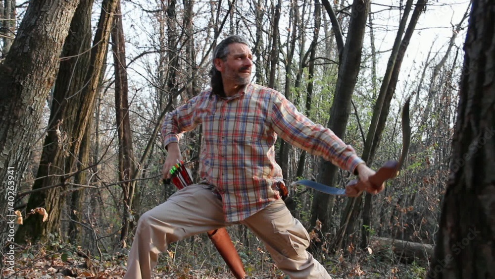 archer shooting his arrows in a forest archer shooting his arrows in a forest