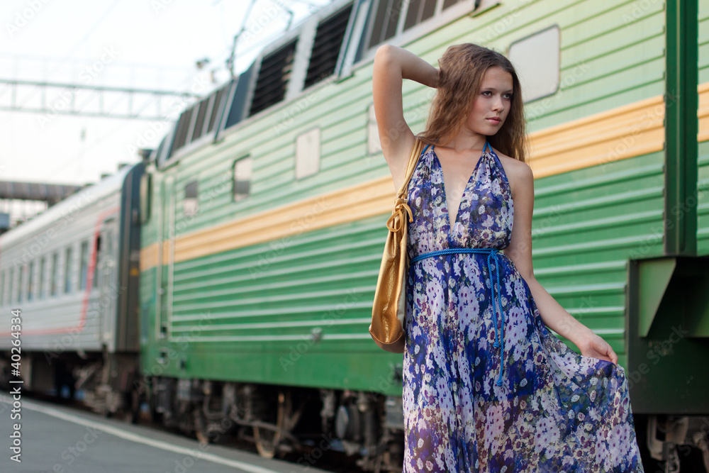 Woman waiting train on the platform Woman waiting train on the platform