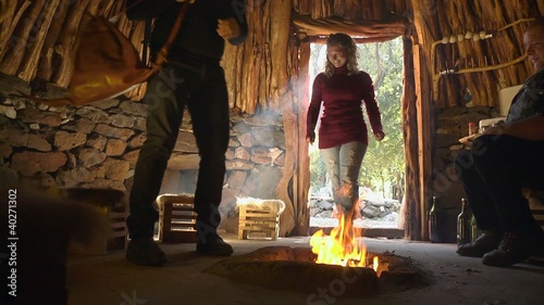 Men and woman drinking after trekking excursion photo