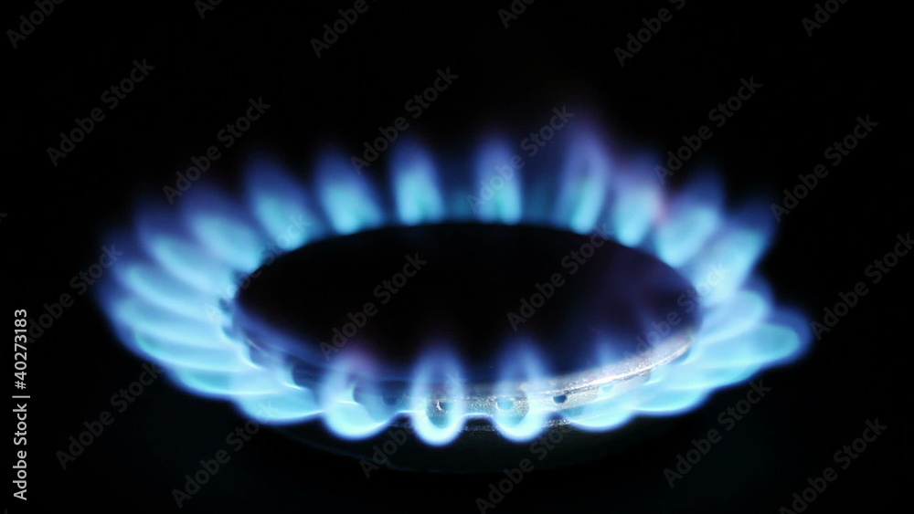 Natural gas inflammation in stove burner, close up view Natural gas inflammation in stove burner, close up view