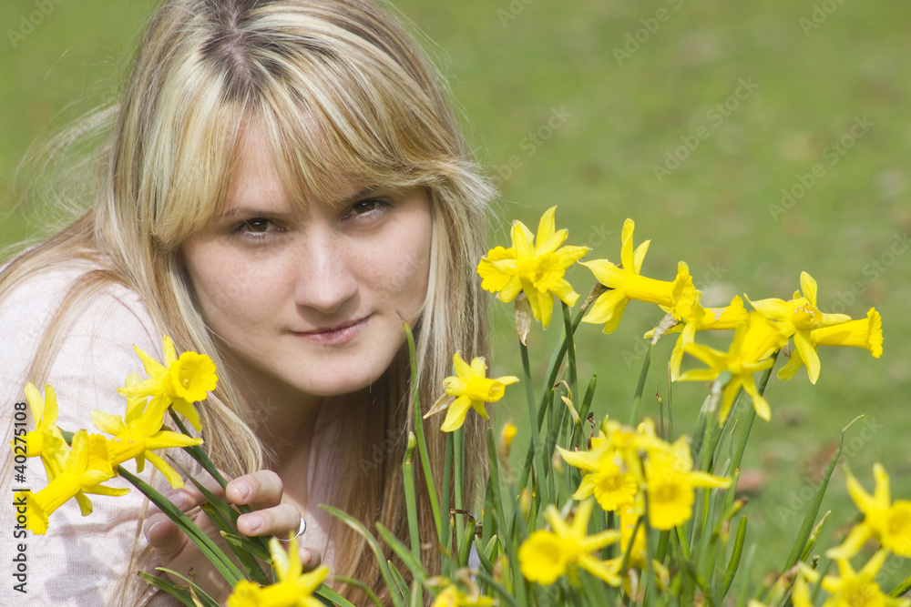 beautiful young woman with flowers on a warm spring day beautiful young woman with flowers on a warm spring day