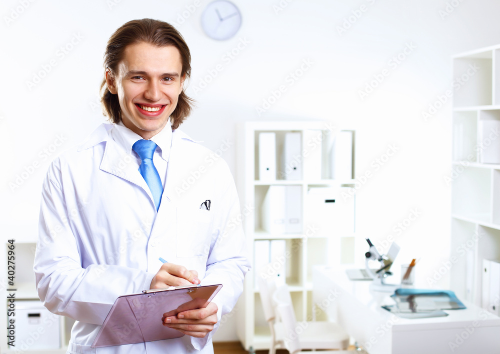 Friendly doctor in medical office Friendly doctor in medical office