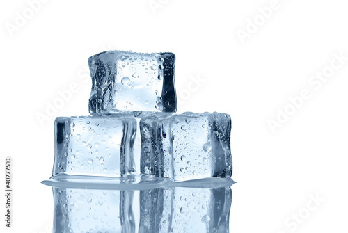 Melting ice cubes over white background with copy space