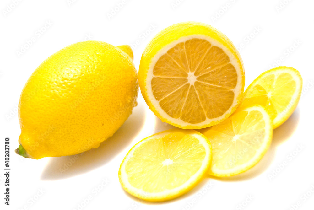 Lemon and lemon slices on white