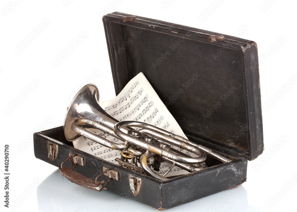 old trumpet and notebook with notes in case isolated on white old trumpet and notebook with notes in case isolated on white
