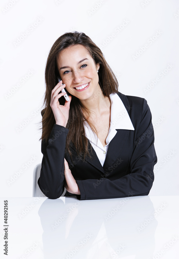 Close-up of a businesswoman talking on the mobile phone. Close-up of a businesswoman talking on the mobile phone.