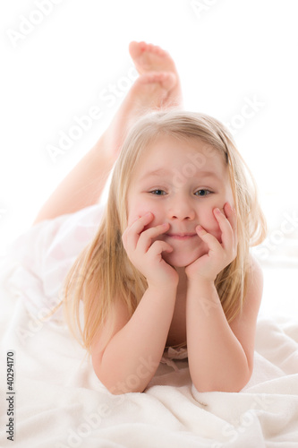 young girl lying on floor in studio