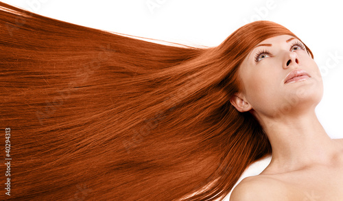 beautiful woman with long red healthy hair