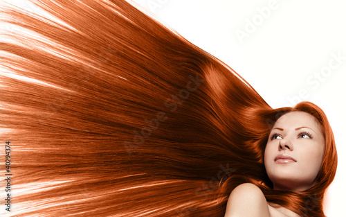 beautiful woman with long red healthy hair