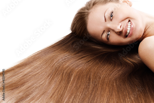 smiling beautiful woman with long healthy brown hair