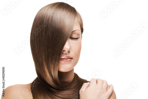 woman holding her elegant long shiny hair , hairstyle