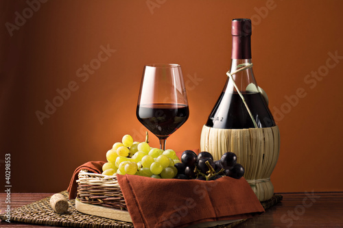 Grape, bottle and glass of wine.