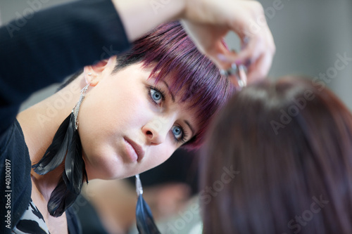 Hairdresser cutting hair