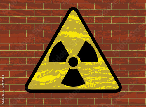 radioactivity trefoil sign on grunge brick wall illustration