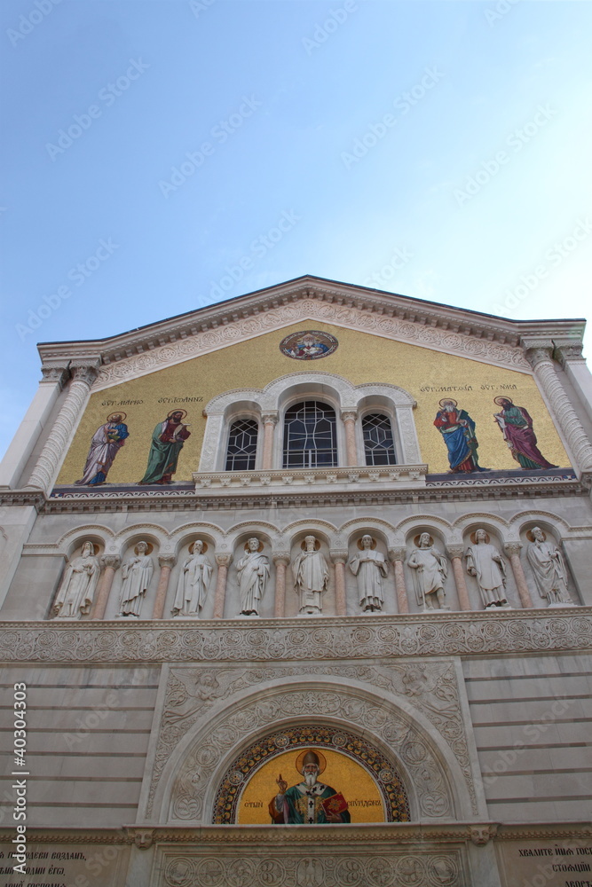 Facade of an Orthodox church with golden mosaics