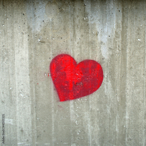 Red hearth on the concrete gray wall